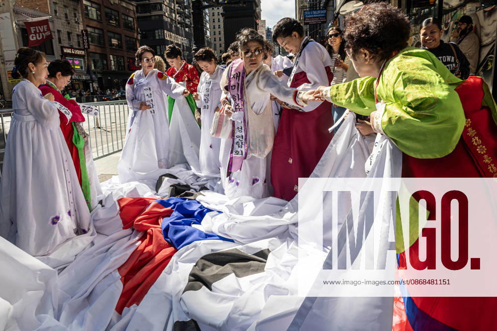 2026 NYC Korean Parade participants get their flags and outfits ready before it starts. New York USA - ZUMAh214 20261003_znp_h214_009