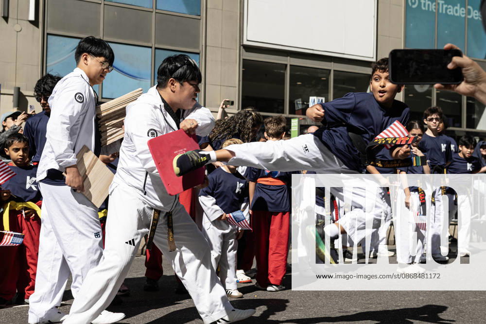 Children from a karate group participating in the 2026 NYC Korean parade perform karate moves for spectators. New York USA - ZUMAh214 20261003_znp_h214_027