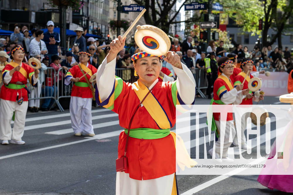 Participants at the 2026 NYC Korean Parade play drums and perform a traditional Korean dance during the parade. New York USA - ZUMAh214 20261003_znp_h214_014