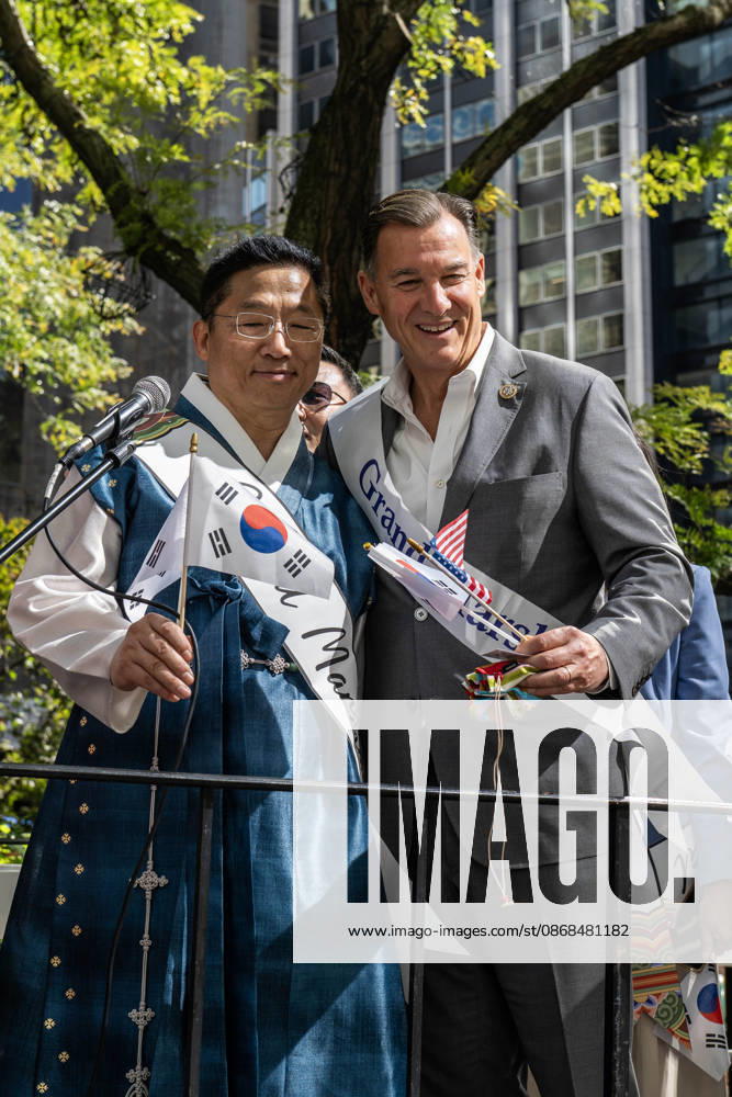 US congressman TOM SUOZZI poses for a photo with a fellow grand mashal on the 2026 NYC Korean parade stage. New York USA - ZUMAh214 20261003_znp_h214_015