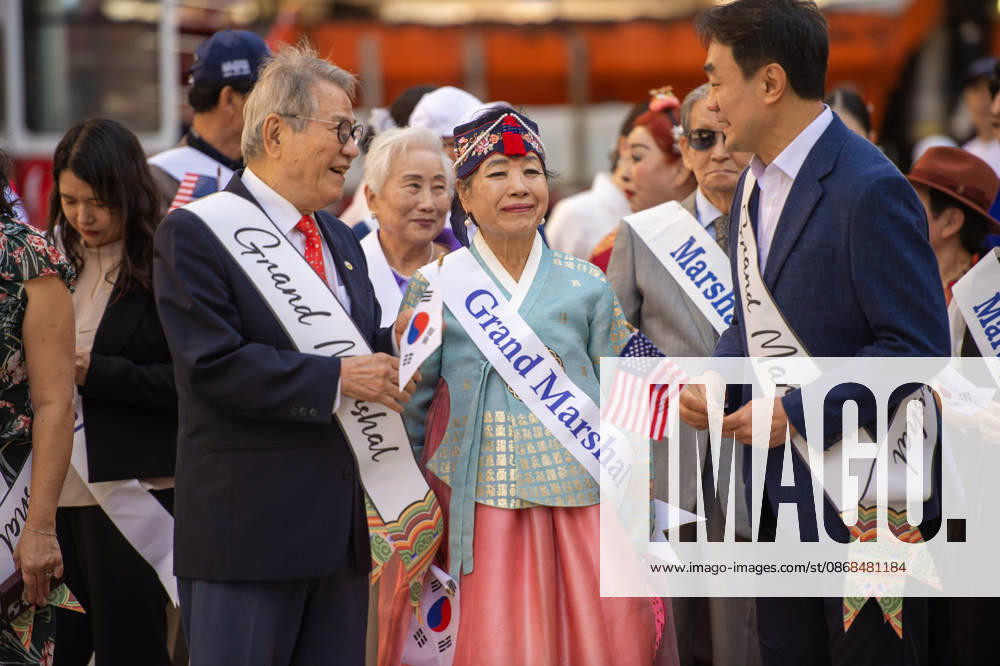 Grand marshals of the 2026 NYC Korean Parade chat with one another before the start of the march. New York USA - ZUMAh214 20261003_znp_h214_033