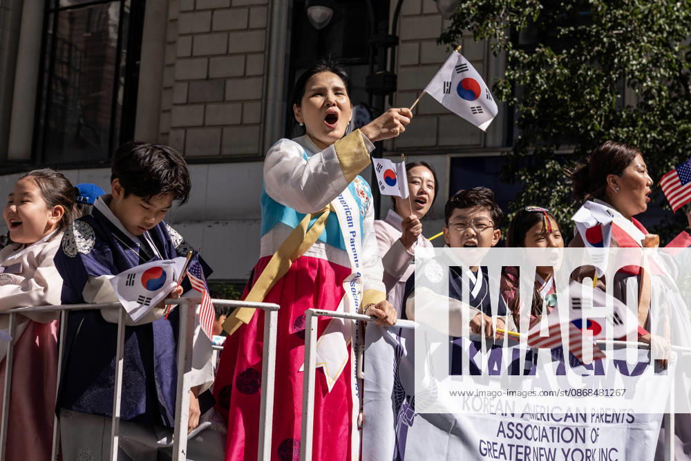 A participant at the 2026 NYC Korean Parade waves her Korean flag on top of a float. New York USA - ZUMAh214 20261003_znp_h214_031