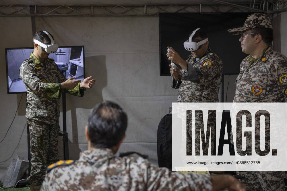 Opening Ceremony Of Second City-Square Military Training Camp Iranian Army servicemen wear virtual reality headsets to shoot with virtual rifles during the opening ceremony of the second city-square military training camp for self-sacrificing forces in downtown Tehran, Iran, on October 3, 2026. The camp was established by the Basij paramilitary force, with personnel from the Islamic Republic of Iran Army responsible for training the volunteers. Tehran Tehran Iran
