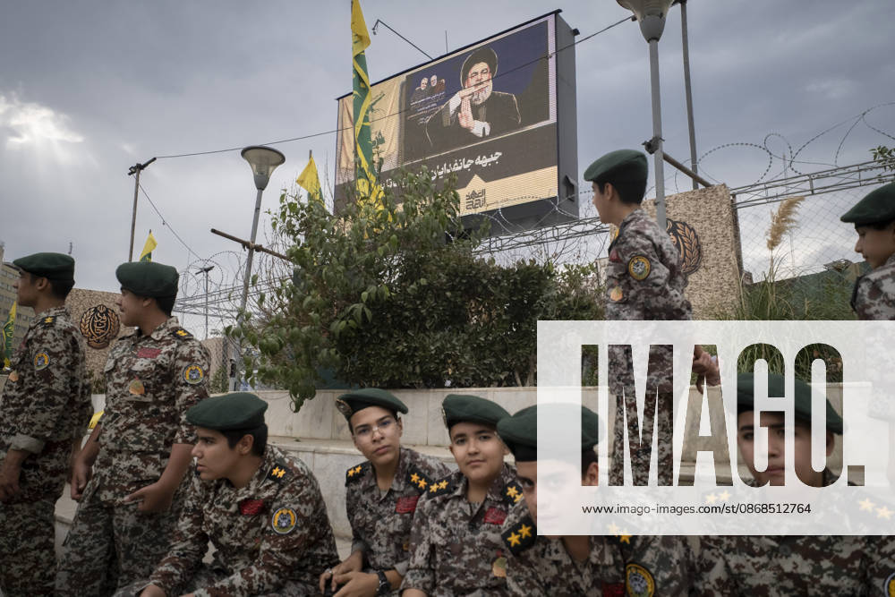 Opening Ceremony Of Second City-Square Military Training Camp Iranian schoolboys wearing military uniforms gather beneath a portrait of Hassan Nasrallah, the late secretary general of Lebanon s Hezbollah, as they prepare to take part in the opening ceremony of the second city-square military training camp for self-sacrificing forces in downtown Tehran, Iran, on October 3, 2026. The camp was established by the Basij paramilitary force, with personnel from the Islamic Republic of Iran Army responsible for training the volunteers. Tehran Tehran Iran