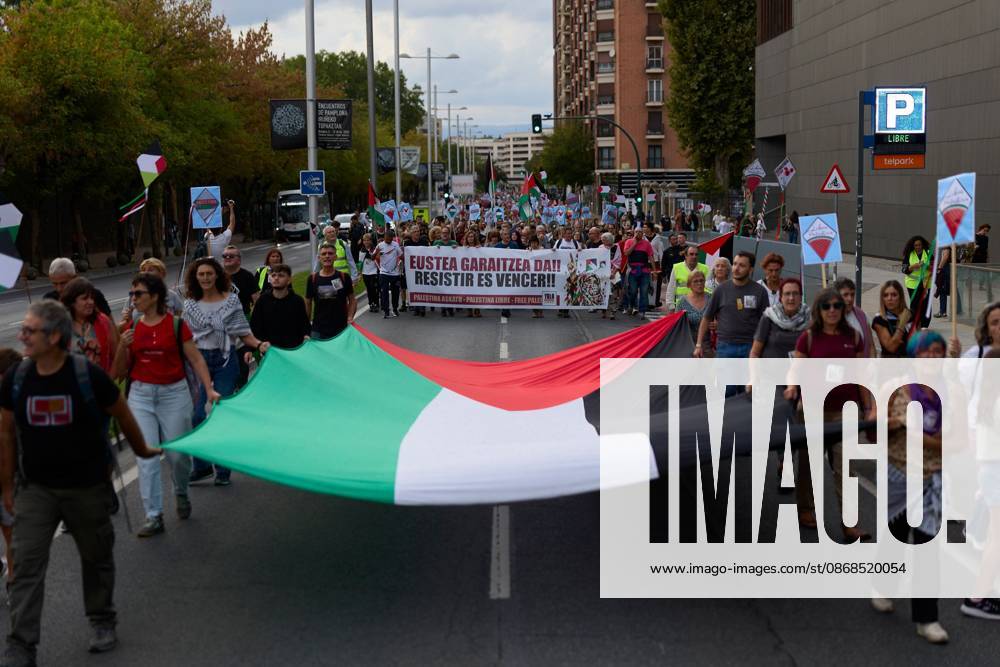 PAMPLONA, SPAIN, OCTOBER 3, 2026: Demonstrators take part in a pro-Palestinian march called by the citizens platform Yala Nafarroa in Pamplona. Protesters carried Palestinian flags and banners expressing solidarity with Gaza, including a large banner reading Stop Genocide, while participants also displayed messages calling for the protection of journalists. Pamplona Spain - ZUMAq101 20261003_zna_q101_125