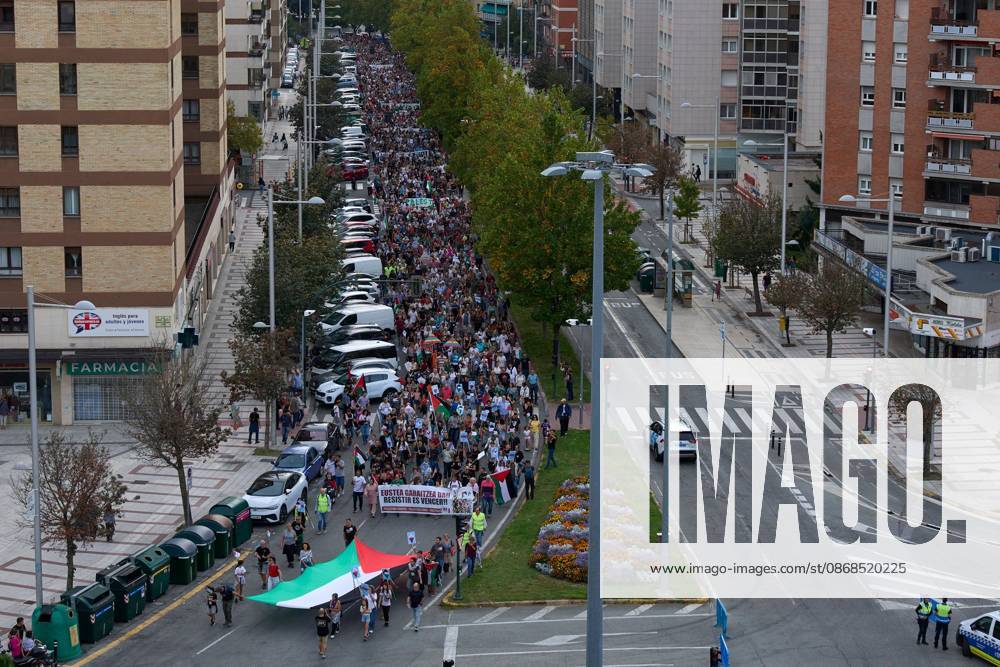 PAMPLONA, SPAIN, OCTOBER 3, 2026: Demonstrators take part in a pro-Palestinian march called by the citizens platform Yala Nafarroa in Pamplona. Protesters carried Palestinian flags and banners expressing solidarity with Gaza, including a large banner reading Stop Genocide, while participants also displayed messages calling for the protection of journalists. Pamplona Spain - ZUMAq101 20261003_zna_q101_128