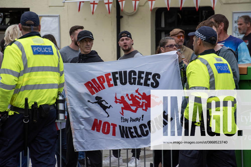 Far-right protesters hold a banner during a demonstration in Dover. Supporters of the English Defence League (EDL) gathered in Dover, UK to march through the town all the way to the harbour. English Defence League is an extreme far-right and Islamophobic organisation. It was founded by Tommy Robinson (pseudonym of Steven Yaxley-Lennon) in 2009. Dover United Kingdom - ZUMAs197 20261003_aaa_s197_243