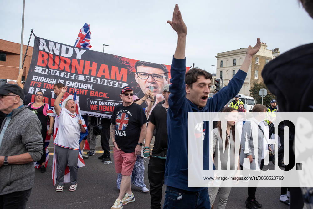 Far-right protesters shout abusive slogans on to the antifascist protesters during a demonstration in Dover. Supporters of the English Defence League (EDL) gathered in Dover, UK to march through the town all the way to the harbour. English Defence League is an extreme far-right and Islamophobic organisation. It was founded by Tommy Robinson (pseudonym of Steven Yaxley-Lennon) in 2009. Dover United Kingdom - ZUMAs197 20261003_aaa_s197_246