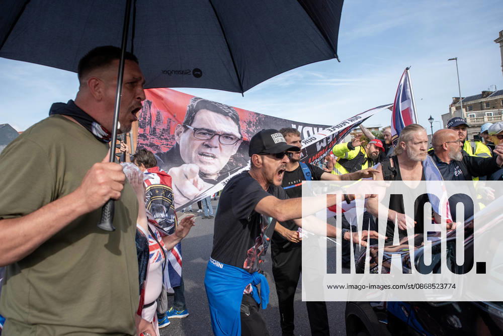 Far-right protesters shout at a driver who tried to drive through on the crowd during a demonstration in Dover. Supporters of the English Defence League (EDL) gathered in Dover, UK to march through the town all the way to the harbour. English Defence League is an extreme far-right and Islamophobic organisation. It was founded by Tommy Robinson (pseudonym of Steven Yaxley-Lennon) in 2009. Dover United Kingdom - ZUMAs197 20261003_aaa_s197_248