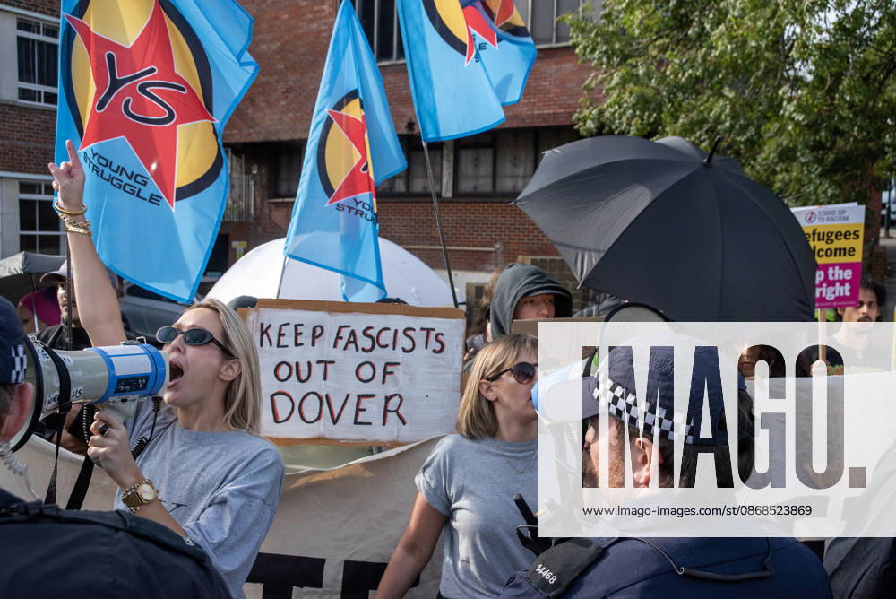 Antifascist protesters holding placards and flags chant slogans during a counter-protest in Dover. Supporters of the English Defence League (EDL) gathered in Dover, UK to march through the town all the way to the harbour. English Defence League is an extreme far-right and Islamophobic organisation. It was founded by Tommy Robinson (pseudonym of Steven Yaxley-Lennon) in 2009. Dover United Kingdom - ZUMAs197 20261003_aaa_s197_252
