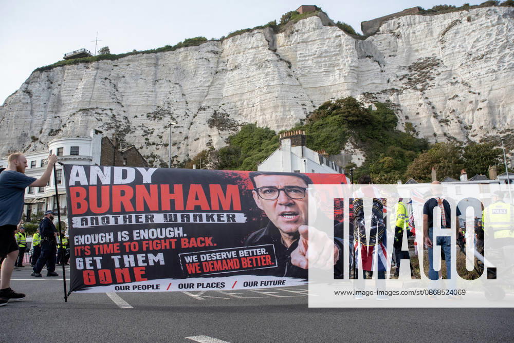 Far-right protesters hold a banner with a photo of the UK Prime Minister, Andy Burnham during a demonstration in Dover. Supporters of the English Defence League (EDL) gathered in Dover, UK to march through the town all the way to the harbour. English Defence League is an extreme far-right and Islamophobic organisation. It was founded by Tommy Robinson (pseudonym of Steven Yaxley-Lennon) in 2009. Dover United Kingdom - ZUMAs197 20261003_aaa_s197_266