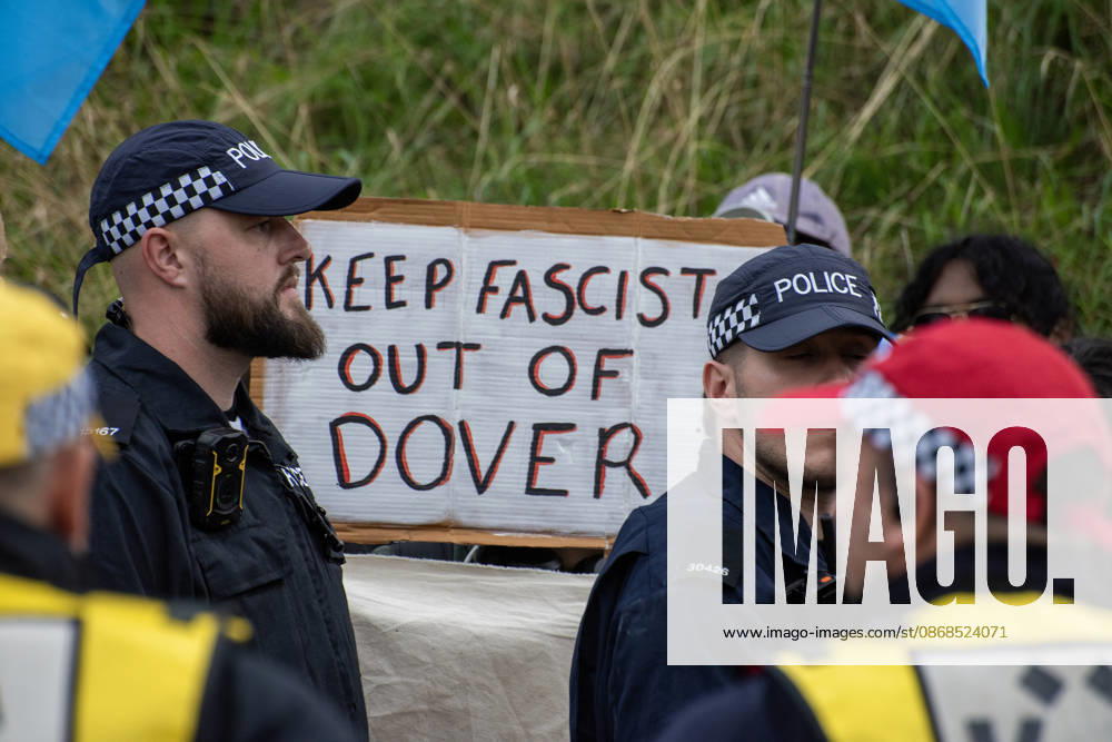 An antifascist protester holds a placard during a counter-protest in Dover. Supporters of the English Defence League (EDL) gathered in Dover, UK to march through the town all the way to the harbour. English Defence League is an extreme far-right and Islamophobic organisation. It was founded by Tommy Robinson (pseudonym of Steven Yaxley-Lennon) in 2009. Dover United Kingdom - ZUMAs197 20261003_aaa_s197_267