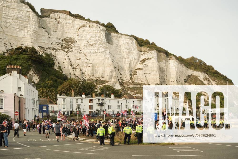 Dover, United Kingdom of Great Britain and Northern Ireland: DOVER, UNITED KINGDOM, OCTOBER 3, 2026: Anti-immigration protesters and anti-racism counter-protesters gather during rival demonstrations in Dover, Kent. Anti-immigration demonstrators carrying Union flags and St George s flags displayed banners calling for deportations and an end to small-boat crossings, while counter-protesters gathered nearby. Police maintained a significant presence between the groups and monitored the demonstrations. Dover United Kingdom of Great Britain and Northern Ireland - ZUMAq101 20261003_zna_q101_205
