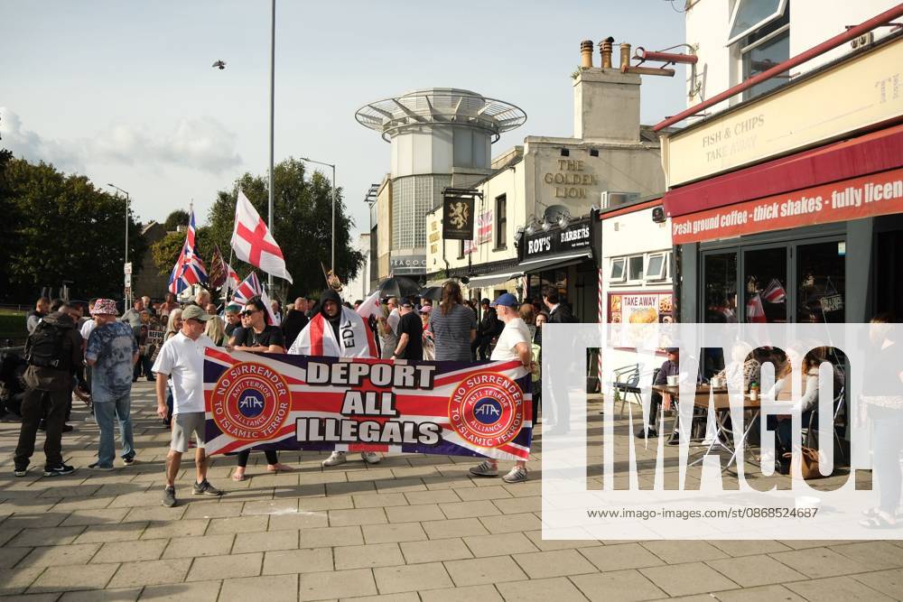 Dover, United Kingdom of Great Britain and Northern Ireland: DOVER, UNITED KINGDOM, OCTOBER 3, 2026: Anti-immigration protesters and anti-racism counter-protesters gather during rival demonstrations in Dover, Kent. Anti-immigration demonstrators carrying Union flags and St George s flags displayed banners calling for deportations and an end to small-boat crossings, while counter-protesters gathered nearby. Police maintained a significant presence between the groups and monitored the demonstrations. Dover United Kingdom of Great Britain and Northern Ireland - ZUMAq101 20261003_zna_q101_209