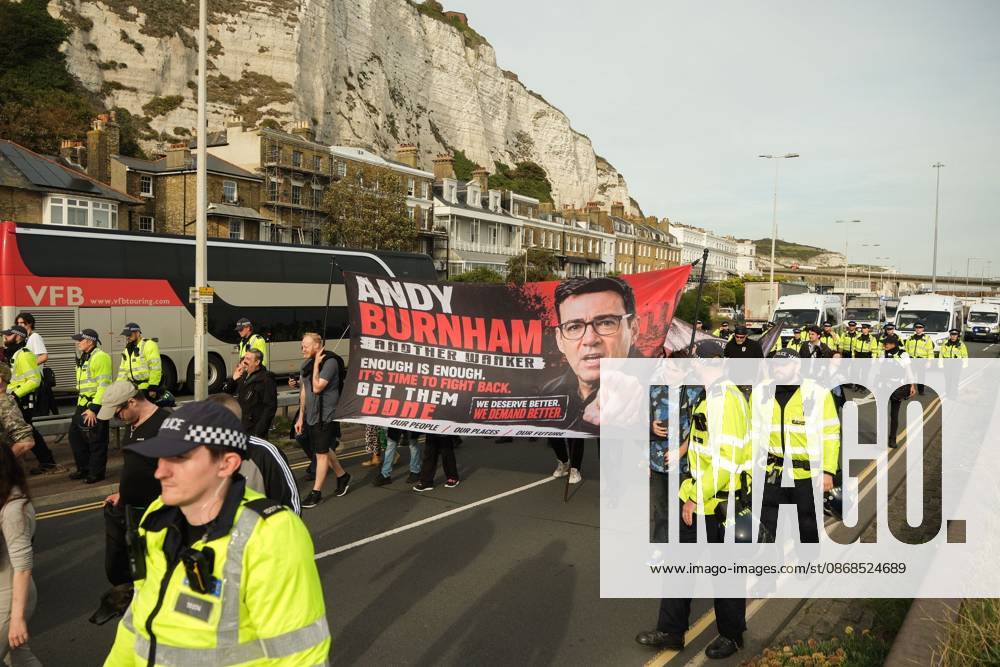 Dover, United Kingdom of Great Britain and Northern Ireland: DOVER, UNITED KINGDOM, OCTOBER 3, 2026: Anti-immigration protesters and anti-racism counter-protesters gather during rival demonstrations in Dover, Kent. Anti-immigration demonstrators carrying Union flags and St George s flags displayed banners calling for deportations and an end to small-boat crossings, while counter-protesters gathered nearby. Police maintained a significant presence between the groups and monitored the demonstrations. Dover United Kingdom of Great Britain and Northern Ireland - ZUMAq101 20261003_zna_q101_210