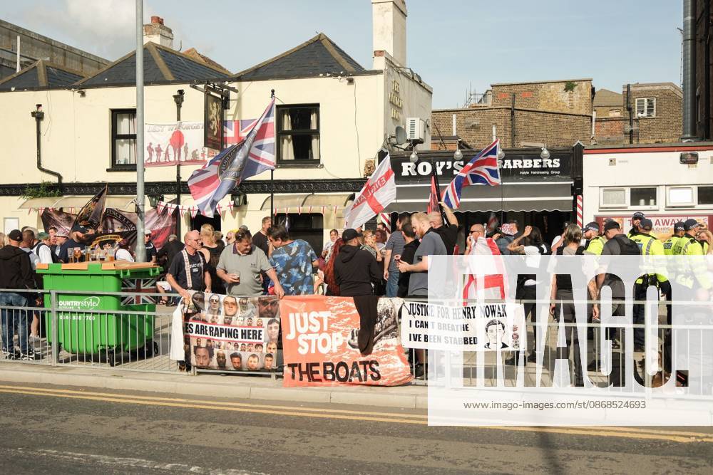 Dover, United Kingdom of Great Britain and Northern Ireland: DOVER, UNITED KINGDOM, OCTOBER 3, 2026: Anti-immigration protesters and anti-racism counter-protesters gather during rival demonstrations in Dover, Kent. Anti-immigration demonstrators carrying Union flags and St George s flags displayed banners calling for deportations and an end to small-boat crossings, while counter-protesters gathered nearby. Police maintained a significant presence between the groups and monitored the demonstrations. Dover United Kingdom of Great Britain and Northern Ireland - ZUMAq101 20261003_zna_q101_212