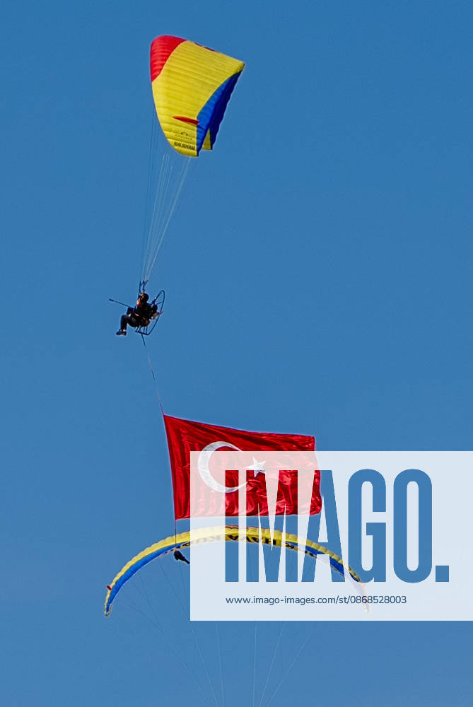 TEKNOFEST Southeast in Turkiye s Sanliurfa SANLIURFA, TURKIYE - OCTOBER 4: Turkish flags are unfurled in the sky during a paramotor demonstration at the Aviation, Space and Technology Festival (TEKNOFEST), world s largest aviation, space, and technology festival at the Sanliurfa GAP Airport for its 15th edition in Sanliurfa, Turkiye on October 4, 2026. Arman Onal Anadolu Sanliurfa Turkey. Editorial use only. Please get in touch for any other usage.