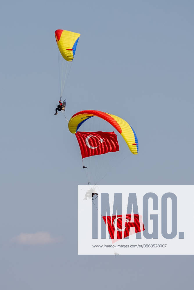 TEKNOFEST Southeast in Turkiye s Sanliurfa SANLIURFA, TURKIYE - OCTOBER 4: Turkish flags are unfurled in the sky during a paramotor demonstration at the Aviation, Space and Technology Festival (TEKNOFEST), world s largest aviation, space, and technology festival at the Sanliurfa GAP Airport for its 15th edition in Sanliurfa, Turkiye on October 4, 2026. Arman Onal Anadolu Sanliurfa Turkey. Editorial use only. Please get in touch for any other usage.
