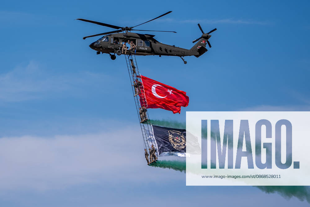 TEKNOFEST Southeast in Turkiye s Sanliurfa SANLIURFA, TURKIYE - OCTOBER 4: Soldiers aboard an S-70 helicopter wave a Turkish flag during a flag flyover at the Aviation, Space and Technology Festival (TEKNOFEST), world s largest aviation, space, and technology festival at the Sanliurfa GAP Airport for its 15th edition in Sanliurfa, Turkiye on October 4, 2026. Arman Onal Anadolu Sanliurfa Turkey. Editorial use only. Please get in touch for any other usage.