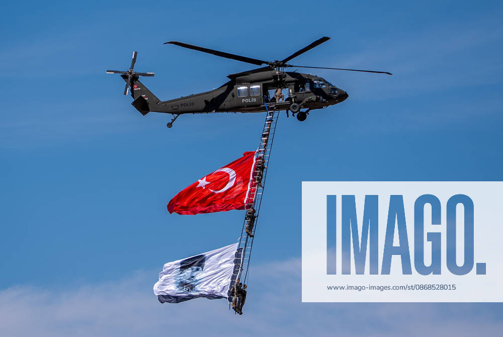 TEKNOFEST Southeast in Turkiye s Sanliurfa SANLIURFA, TURKIYE - OCTOBER 4: Soldiers aboard an S-70 helicopter wave a Turkish flag during a flag flyover at the Aviation, Space and Technology Festival (TEKNOFEST), world s largest aviation, space, and technology festival at the Sanliurfa GAP Airport for its 15th edition in Sanliurfa, Turkiye on October 4, 2026. Arman Onal Anadolu Sanliurfa Turkey. Editorial use only. Please get in touch for any other usage.