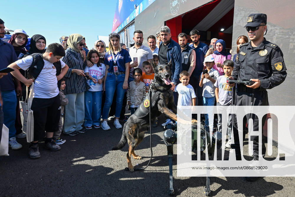 TEKNOFEST Southeast in Turkiye s Sanliurfa SANLIURFA, TURKIYE - OCTOBER 04: Visitors watch a police dog demonstration during TEKNOFEST at Sanliurfa GAP Airport in Sanliurfa, Turkiye, on October 04, 2026. The festival is organized by the Turkish Ministry of Industry and Technology and the T3 Foundation, with Anadolu serving as its Global Communication Partner. Adsiz Gunebakan Anadolu Sanliurfa Turkey. Editorial use only. Please get in touch for any other usage.
