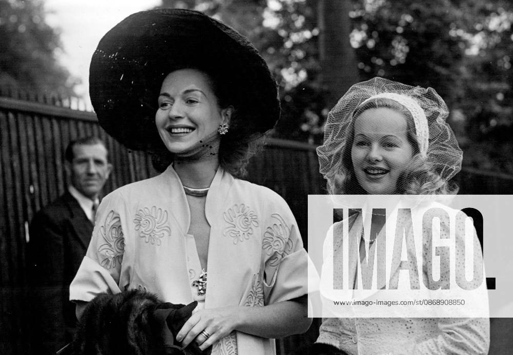 Gold Cup Day At Ascot -- Miss Greta Gynt wearing straw hat, and Miss Peggy Cummings, all in white, two welknown actresses on arrival at Ascot. June 14, 1951. (Photo by Fox Photos)