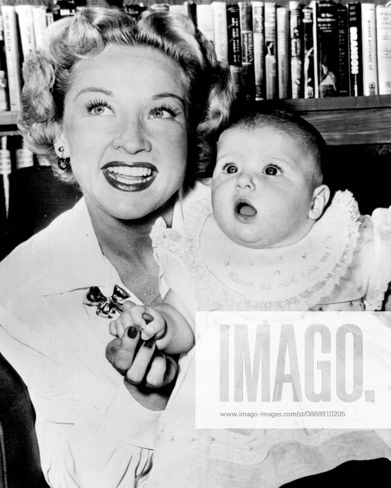 Bonita Granville And Daughter -- Six-months-old Linda Bonita Wrather, who s starting life as the daughter of a movie star and heiress to a Texas oil fortune, seems amazed by the antics of the photographer making her first picture. Mother Bonita Granville and Father Jack Wrather, Texas oil man who became a movie producer, left for a European tour shortly after this picture was made several days ago. October 13, 1949. (Photo by AP Wirephoto).