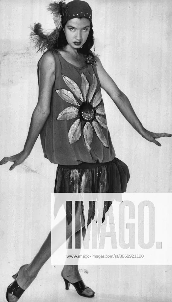 Burlesque -- Dancer Peggy Ryan gives her horrified reaction to the new Christian Dior H Look. Suitable only for the Chariston, she claims Peggy arrives in Sydney soon to appear with Johnnie Ray. September 03, 1954.