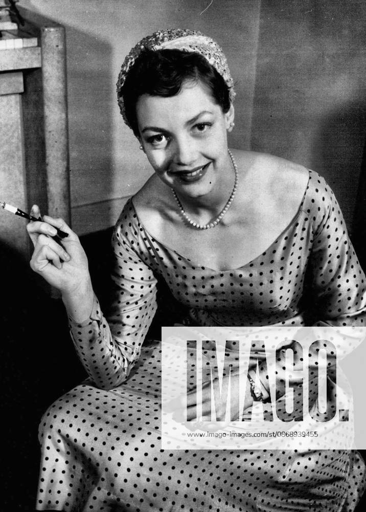 Actress is Her Own Dressmaker. Glamorous to her skilled finger tips is film star Diane Hart, who has the distinction of being an actress capable of making her own clothes. She is pictured at her London home in one of her own creations - a