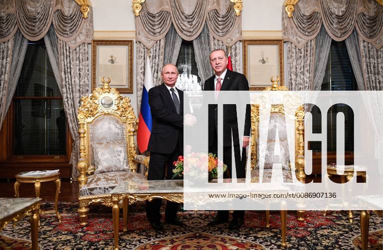 Russia s President Vladimir Putin (L) and Turkey s President Recep Tayyip Erdogan shake hands during a meeting at Yildiz Palace. Ramil Sitdikov Sputnik POOL TASS TS09809C