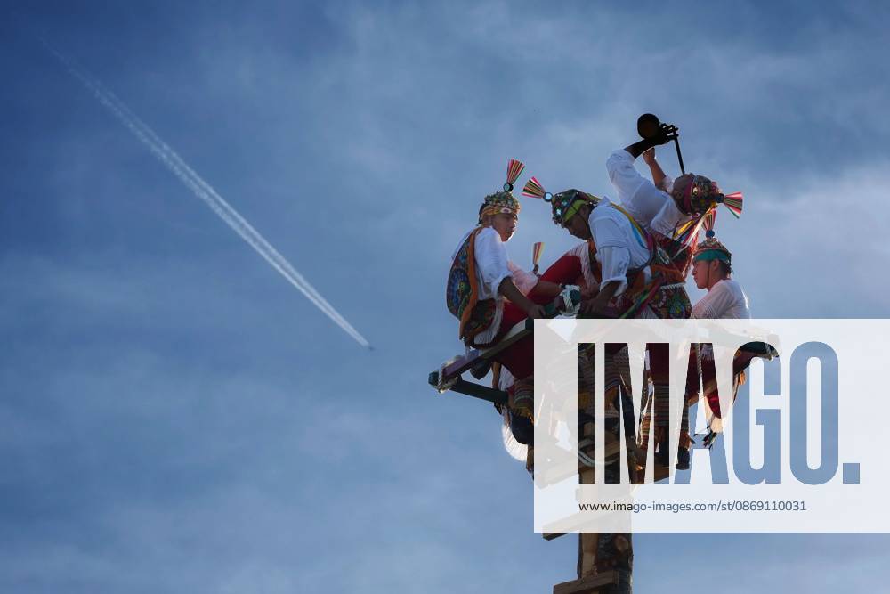 PAMPLONA, SPAIN - OCTOBER 9, 2026: The Voladores de Papantla perform their ceremonial descent from a high pole at Vuelta del Castillo during the 2026 Encuentros de Pamplona IruoÂ±eko Topaketak festival. Rooted in the Totonac culture of Veracruz, Mexico, the ritual brings together five men: four voladores descend tied to ropes while circling the pole, as a caporal remains at the top playing flute and drum. The ceremony symbolises respect for nature, spiritual harmony and the renewal of life, and is recognised by UNESCO as Intangible Cultural Heritage of Humanity. Pamplona Spain - ZUMAq101 20261009_zna_q101_142