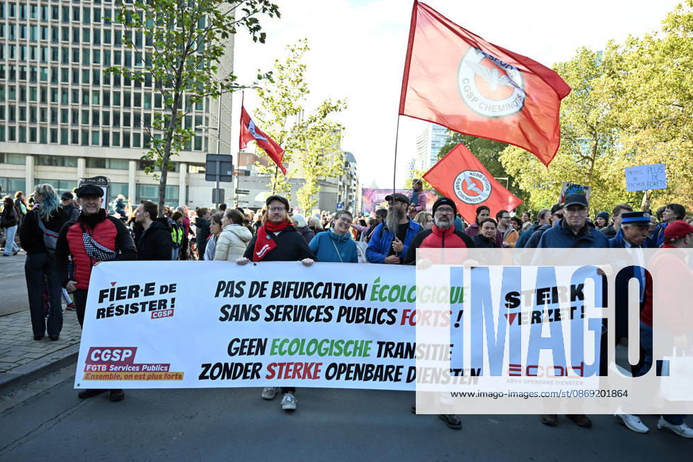 Tens of thousands march in Brussels demanding stronger climate action BRUSSELS, BELGIUM - OCTOBER 11: Demonstrators hold climate-themed placards as tens of thousands of people march through Brussels calling for stronger action against climate change and reduced dependence on fossil fuels, on October 11, 2026 in Brussels, Belgium. The protest was organized by the Belgian Climate Coalition, which brings together around 100 civil society organizations. Participants marched along major roads toward Schuman Square, home to several European Union institutions, while protesting the government s climate policies. Dursun Aydemir Anadolu Brussels Belgium. Editorial use only. Please get in touch for any other usage.
