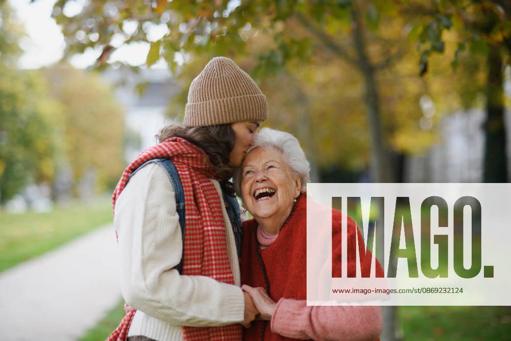 Portrait of a granddaughter on an autumn walk in the park with her grandmother. Portrait of granddaughter on an autumn walk in the park with her grandmother. model released