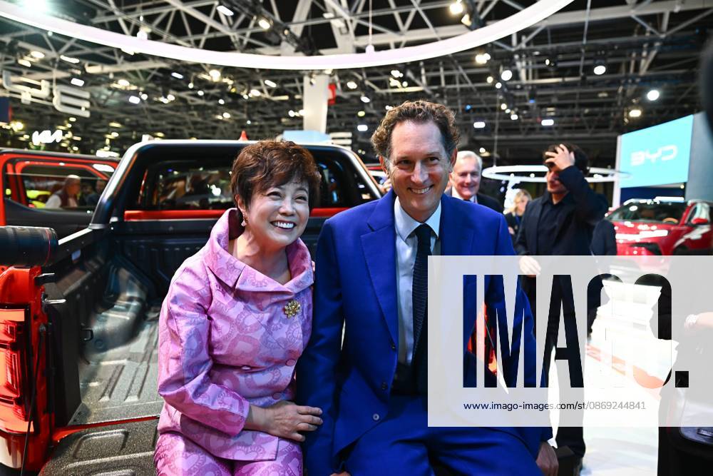 2026 PARIS AUTO SHOW PHOTOPQR OUEST FRANCE Franck Dubray Paris Oct. 12, 2026 Paris Auto Show at Porte de Versailles in Paris BYD booth: Stella Li and John Elkann, president of Stellantis Photo by Franck Dubray Oct. 12, 2026 Paris Motor Show, Paris, France