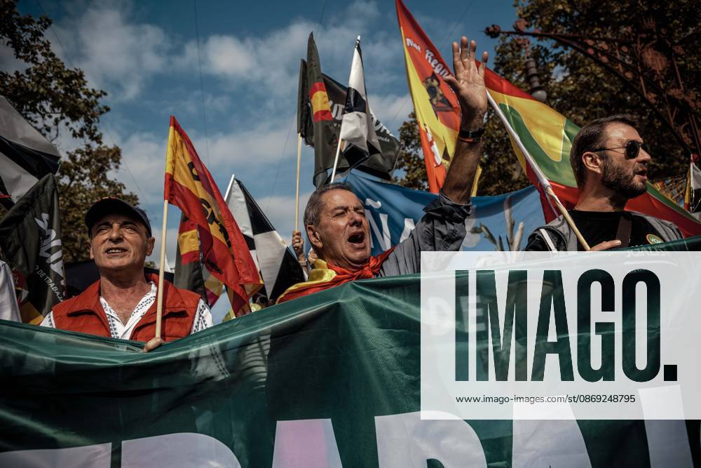 Demonstrators chant slogans behind a banner during a rally marking Spainâ€⠢s National Day. Barcelona Spain - ZUMAo105 20261012_fap_o105_003