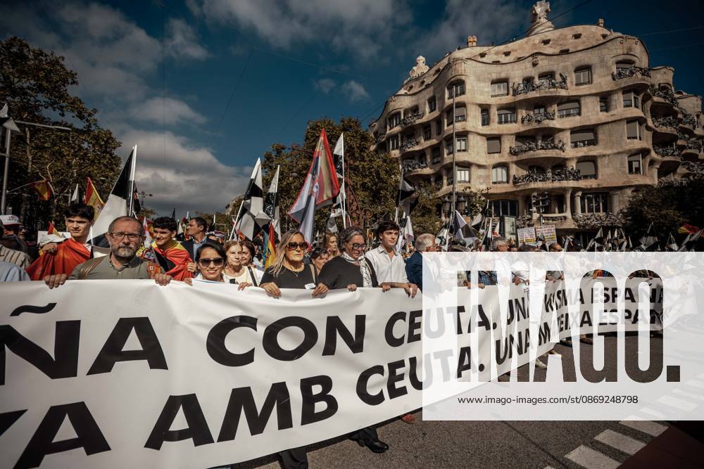 Demonstrators march behind a banner reading Catalonia with Ceuta. One Spain during a rally marking Spainâ€⠢s National Day. Barcelona Spain - ZUMAo105 20261012_fap_o105_006