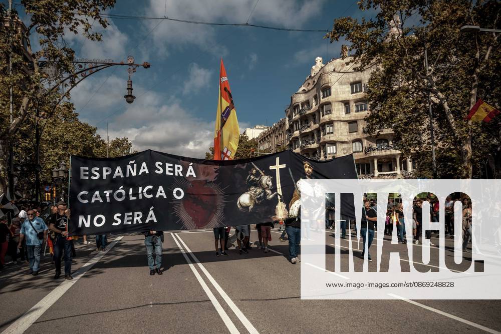 Demonstrators march behind a banner reading Spain will be Catholic, or it will not be. during a rally marking Spainâ€⠢s National Day. Barcelona Spain - ZUMAo105 20261012_fap_o105_010