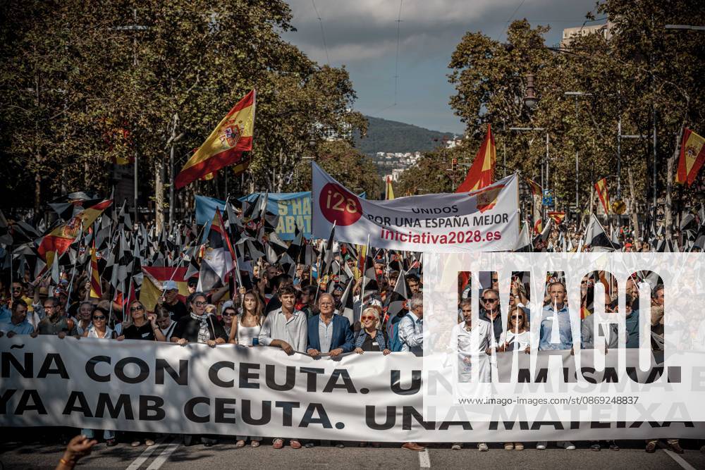 Demonstrators march behind a banner reading Catalonia with Ceuta. One Spain during a rally marking Spainâ€⠢s National Day Barcelona Spain - ZUMAo105 20261012_fap_o105_014