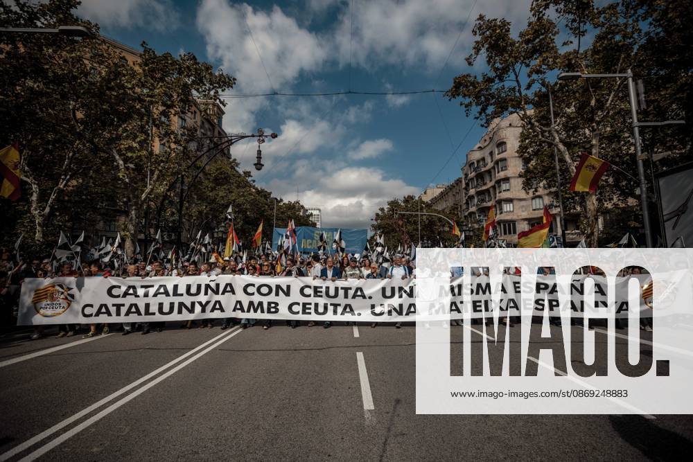 Demonstrators march behind a banner reading Catalonia with Ceuta. One Spain during a rally marking Spainâ€⠢s National Day. Barcelona Spain - ZUMAo105 20261012_fap_o105_019