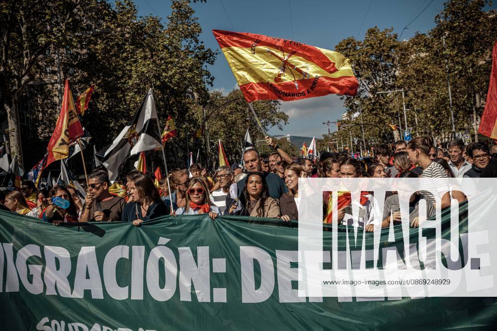 Demonstrators chant slogans behind a banner during a rally marking Spainâ€⠢s National Day. Barcelona Spain - ZUMAo105 20261012_fap_o105_025