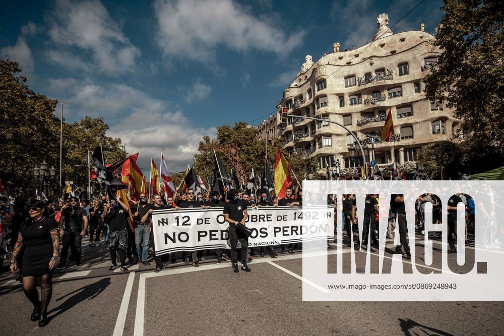 Demonstrators march behind a banner reading October 12, 1492: We do not ask for forgiveness. during a rally marking Spainâ€⠢s National Day Barcelona Spain - ZUMAo105 20261012_fap_o105_034