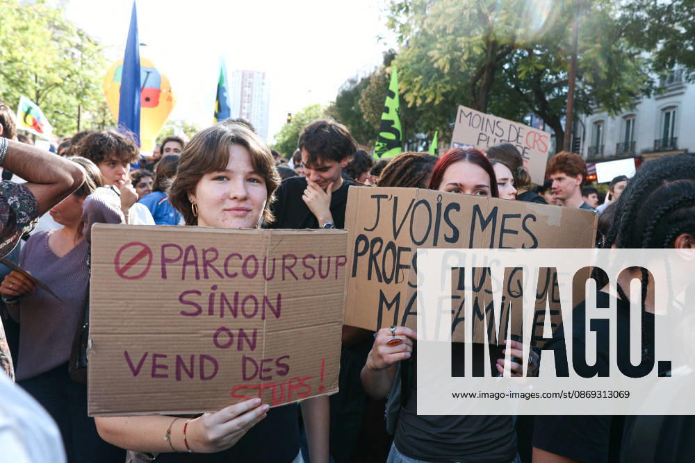 Students Protest in Paris - France Two protesters hold signs reading End of parcoursup, or else we sell drugs and I value you teachers more than my family during a nationwide youth demonstration. Nationwide mobilization by high school and university students calling for better teaching and study conditions, increased funding and staffing, an end to overcrowded classrooms and deteriorating infrastructure, and improved access to education, amidst concerns over social inequalities and student financial insecurity in Paris, France, October 13, 2026. Photo by Christophe Michel ABACAPRESS.COM Paris ILE DE FRANCE France