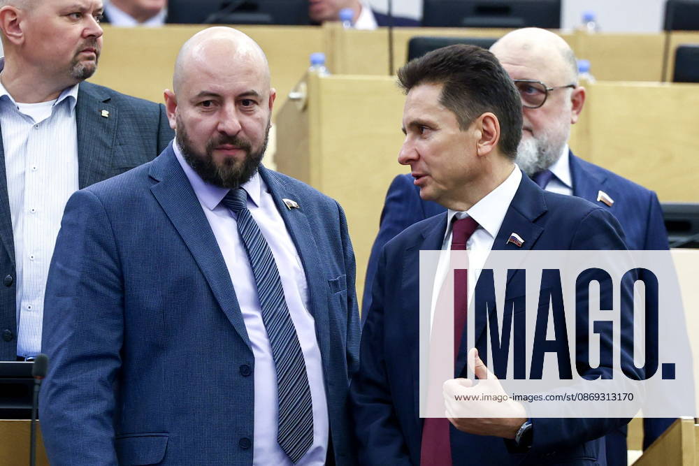 RUSSIA, MOSCOW - OCTOBER 13, 2026: Russian State Duma members Alexei Savin and Vyacheslav Petrov (L-R front) attend a plenary meeting of the Russian State Duma. Russian State Duma Press Office TASS 99239126