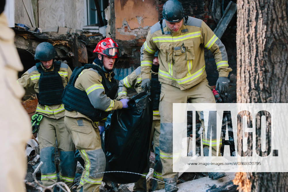 Consequences Of The Attack On Kharkiv Rescuers carry the body of a woman killed in an attack in Kharkiv, Ukraine, on October 13, 2026. Kharkiv Ukraine