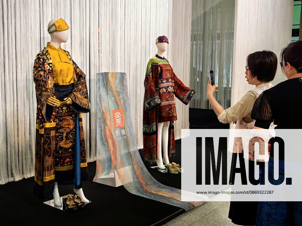 Models present designs featuring traditional ethnic minority techniques during the Shanghai Fashion Week Oriental New Chinese Style 2026 Autumn series at the Shanghai History Museum on October 13, 2026 in Shanghai, China. The event showcases clothing integrating Guizhou intangible cultural heritage patterns including Miao embroidery, Dong brocade, horsehair embroidery, batik and maple wax dyeing into contemporary fashion.
