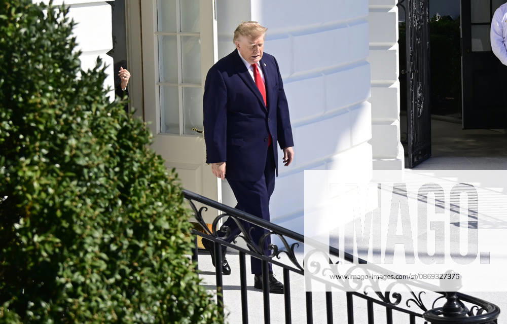 United States President Donald J Trump emerges from the Diplomatic Entrance as he departs for a campaign trip to Alaska, Nevada, Arizona and Montana from the South Lawn of the White House in Washington, DC, USA, on Tuesday, October 13, 2026 Washington USA - ZUMAs152 20261013_faa_s152_040