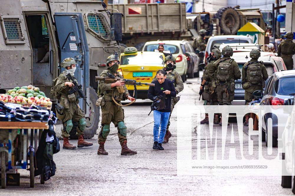 Ramallah, Palestine, State of: RAMALLAH, WEST BANK, PALESTINE, OCTOBER 13, 2026: Israeli forces conduct a raid in Ramallah in the occupied West Bank. The operation includes a raid on the offices of Addameer Prisoner Support and Human Rights Association. The Palestinian Ministry of Health reported two people wounded, including a 14-year-old boy wounded by Israeli gunfire, while several others were treated for tear gas inhalation. Ramallah Palestine, State of - ZUMAq101 20261013_zna_q101_186