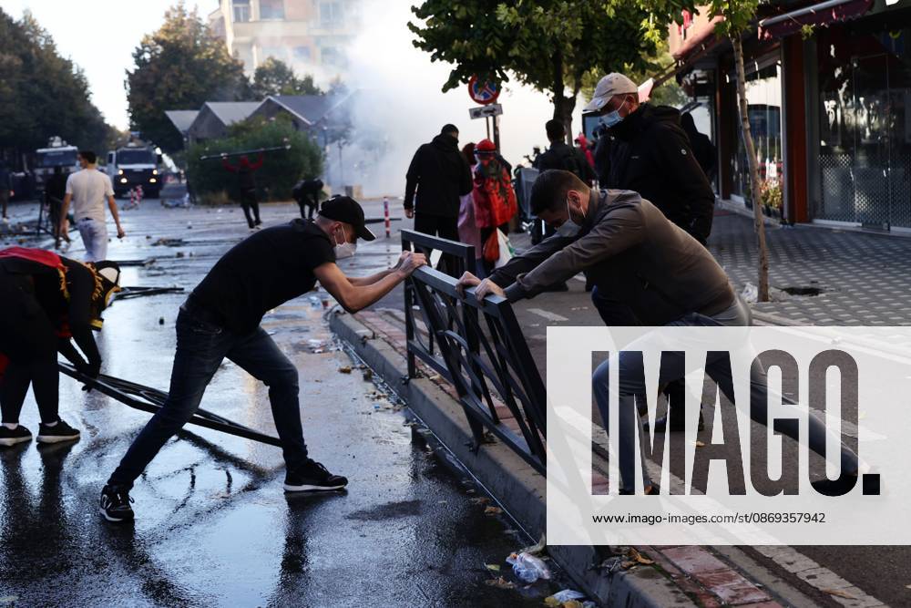 TIRANA, ALBANIA, OCTOBER 13, 2026: Student demonstrators clash with riot police outside the Ministry of Education in Tirana during a protest over university conditions, higher education costs and employment prospects. Police deploy tear gas and water cannons as protesters throw bricks and other objects. Several demonstrators are detained. Tirana Albania - ZUMAq101 20261013_zna_q101_259