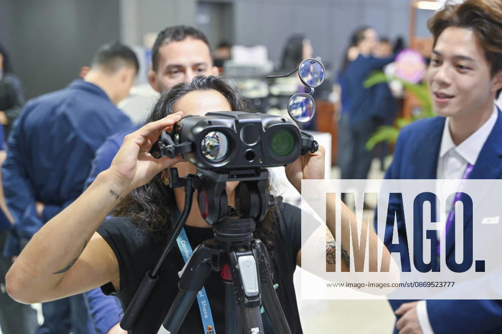 An overseas buyer experiences a photoelectric night vision telescope during the 140th China Import and Export Fair (Canton Fair) on October 15, 2026 in Guangzhou, Guangdong Province of China. The fair runs in three phases until November 4, covering a total exhibition area of 1.55 million square meters.