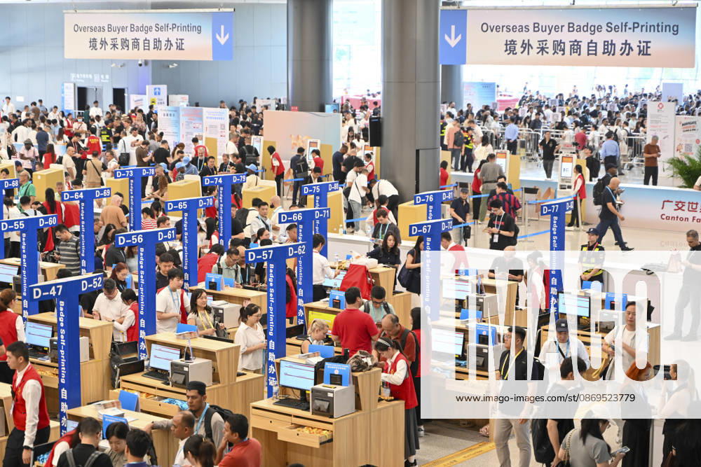 Overseas buyers handle entry credentials at the registration hall of the 140th China Import and Export Fair (Canton Fair) on October 15, 2026 in Guangzhou, Guangdong Province of China. The fair runs in three phases until November 4, covering a total exhibition area of 1.55 million square meters.